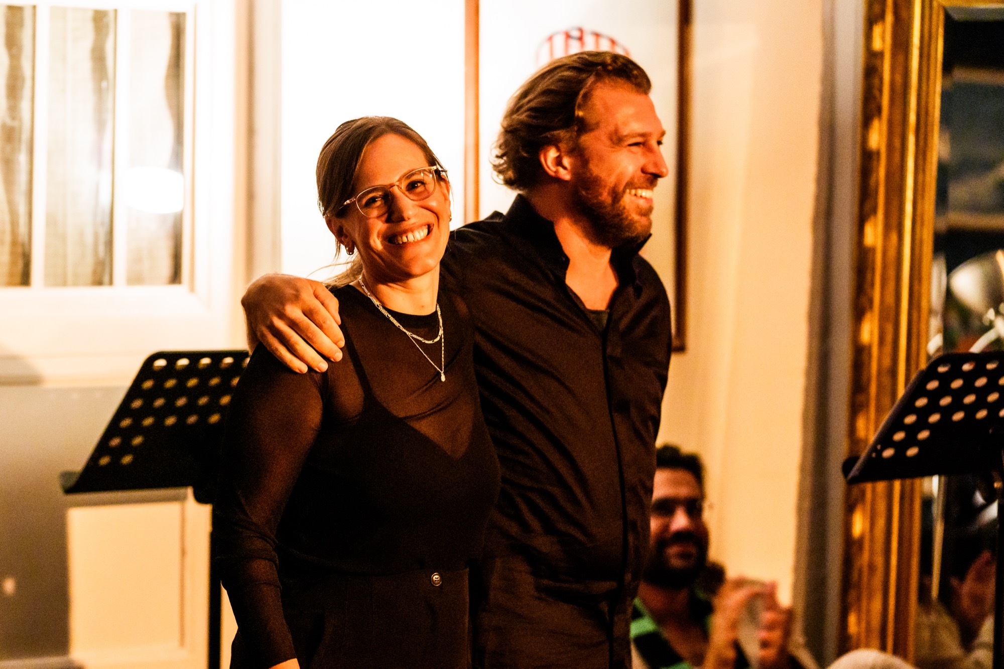 Yael Kareth sharing a joyful moment with a colleague after a performance